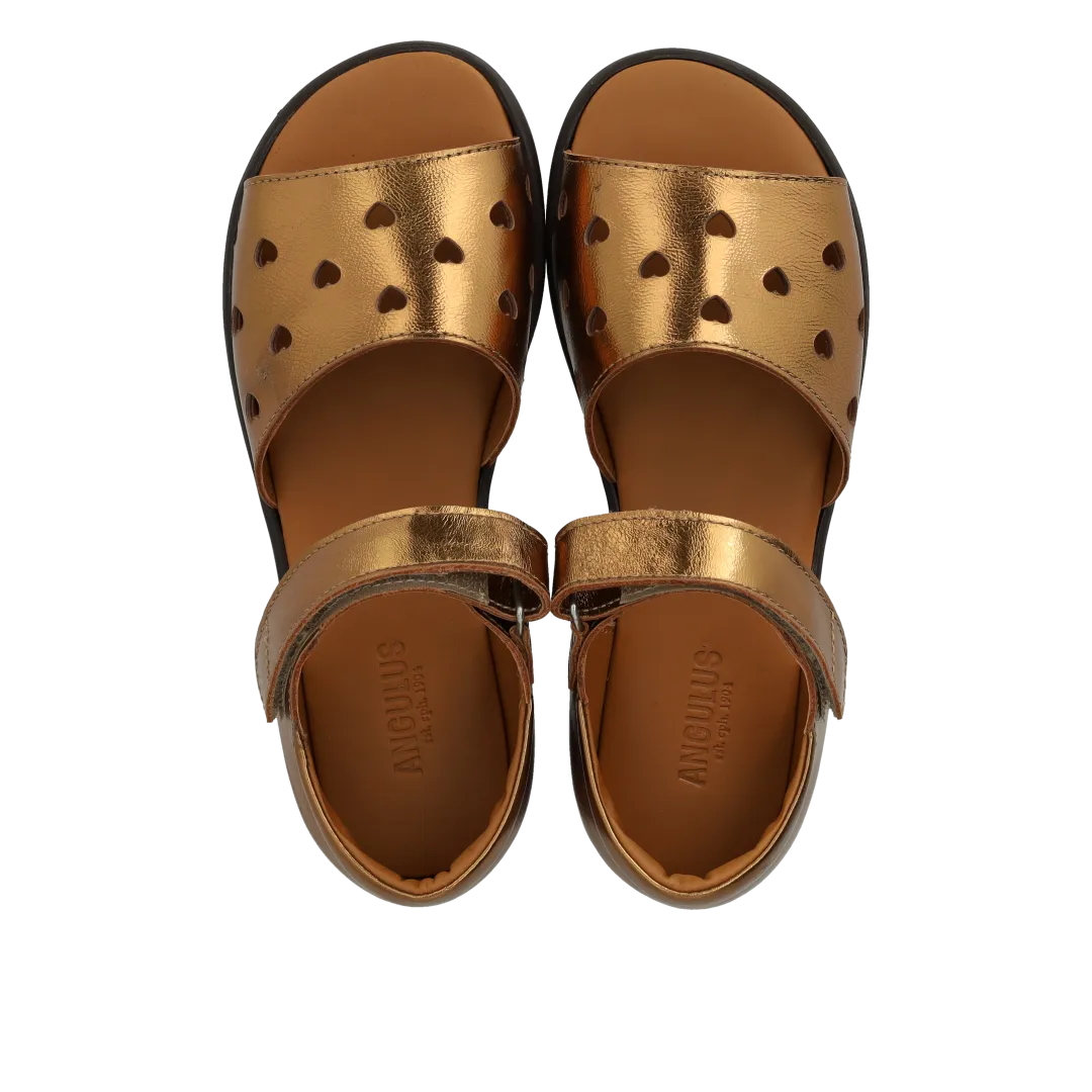 Leather sandal with die-cut heart pattern
